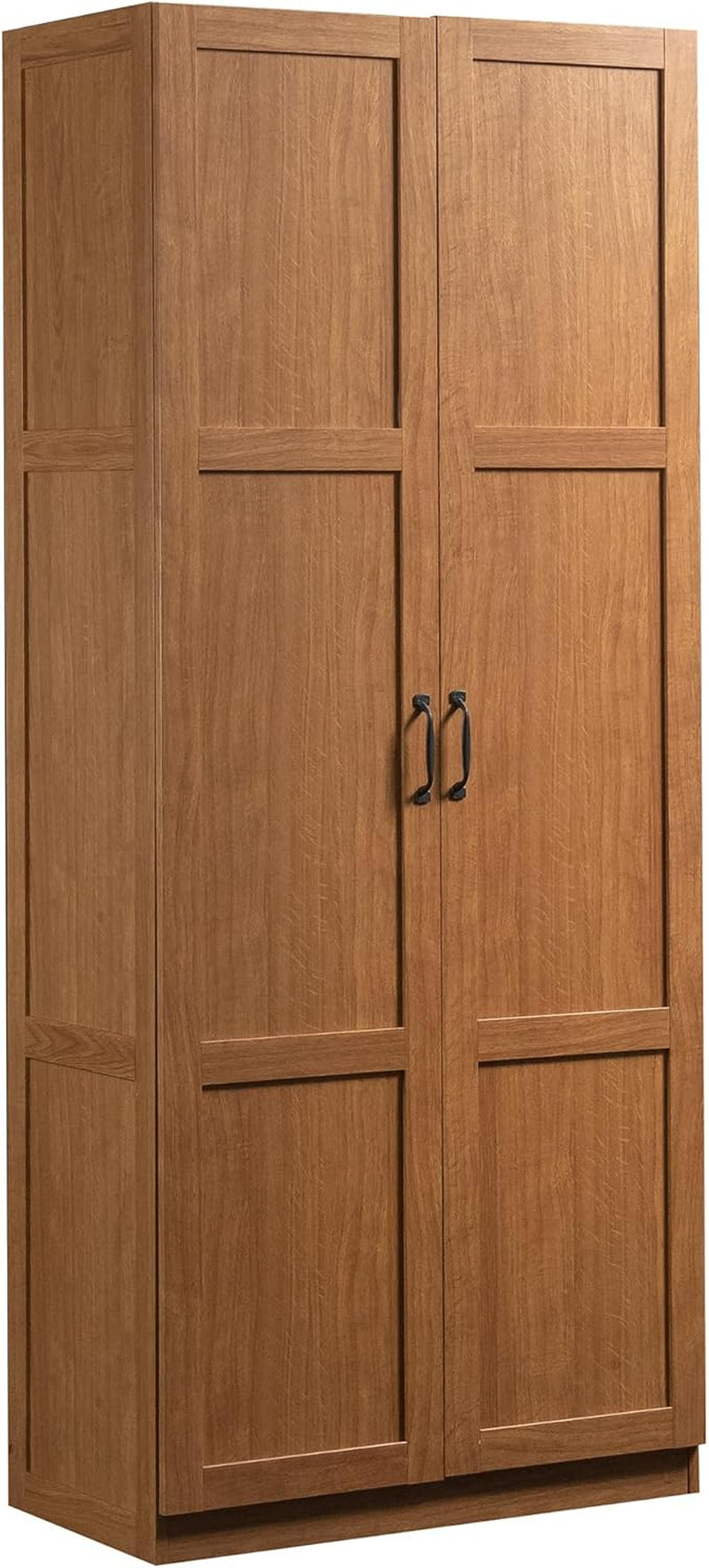 Tall two-door storage cabinet in a warm cinnamon wood finish with black arch handles.