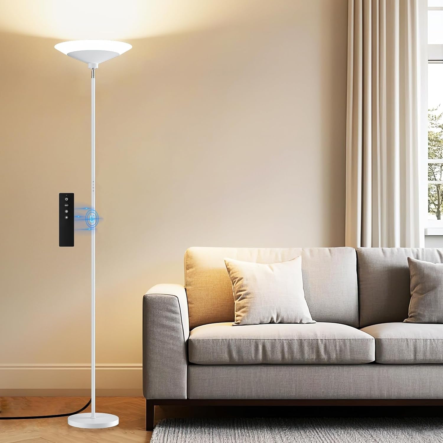 White torchiere floor lamp beside a neutral sofa, producing a soft wash of light upward.