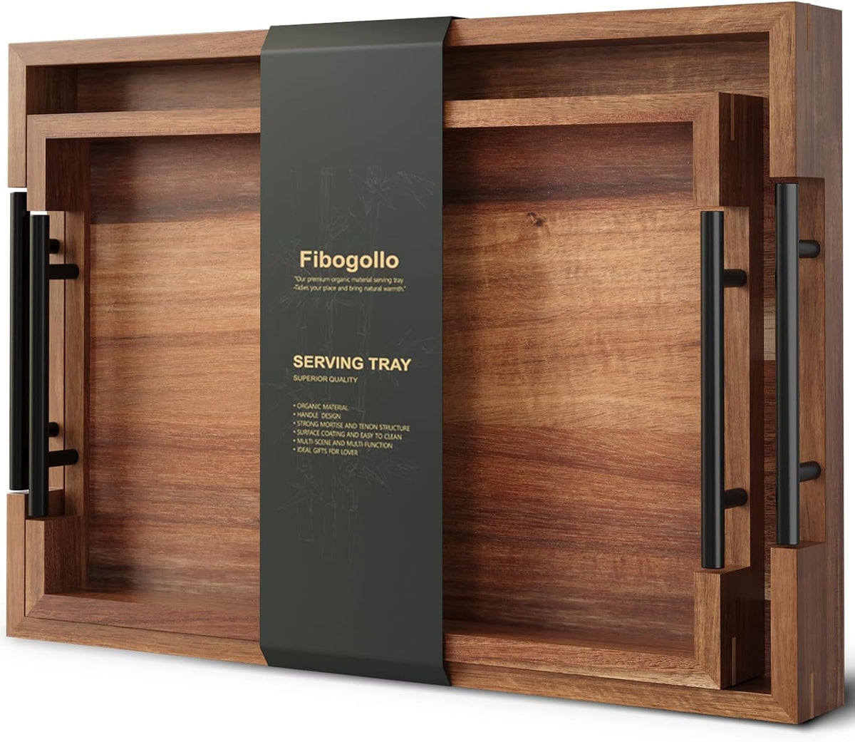 Angled close view of two stacked rectangular acacia trays with black tubular handles and central dark packaging band