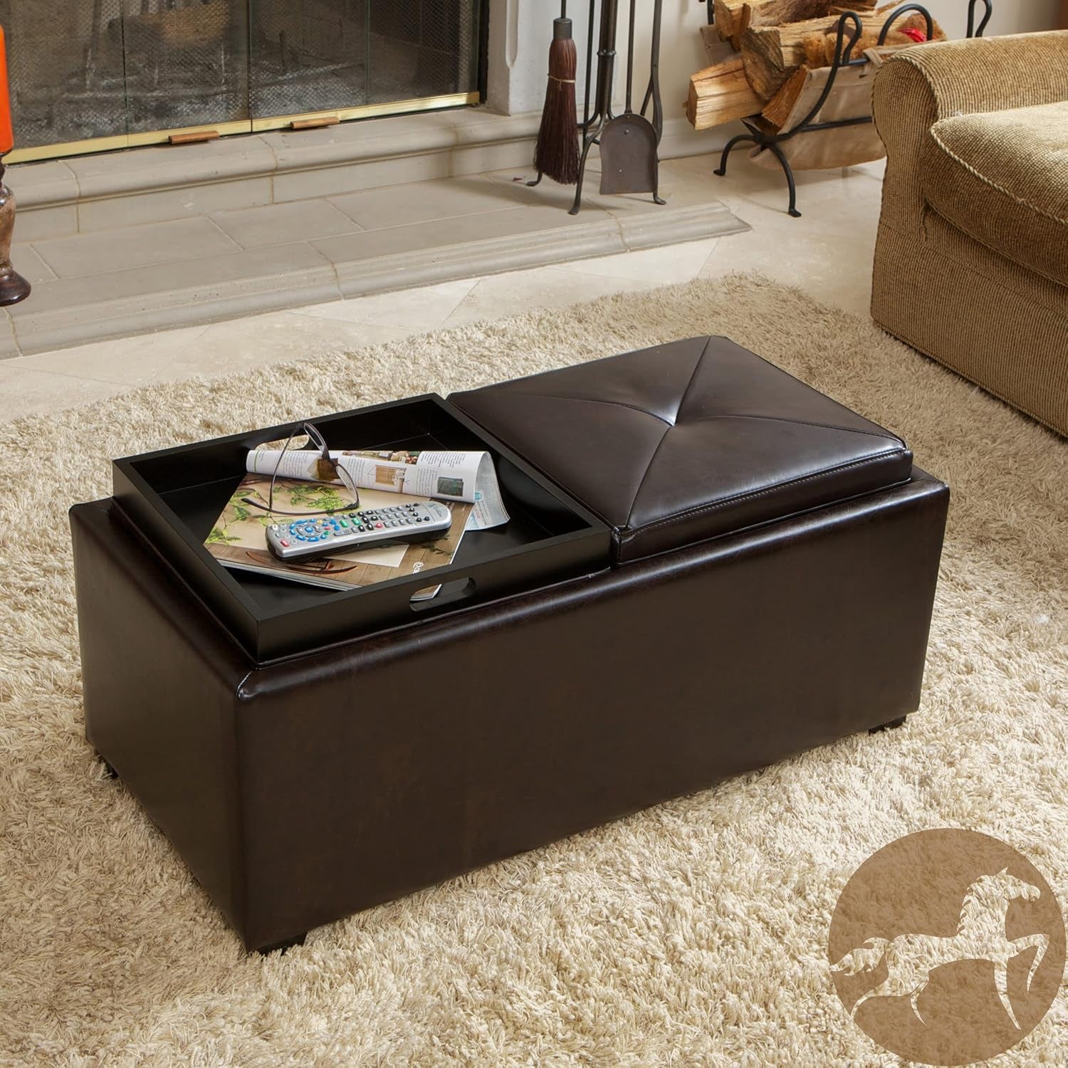 Brown bonded leather storage ottoman in a living room with one tray opened showing the internal compartment and serving tray