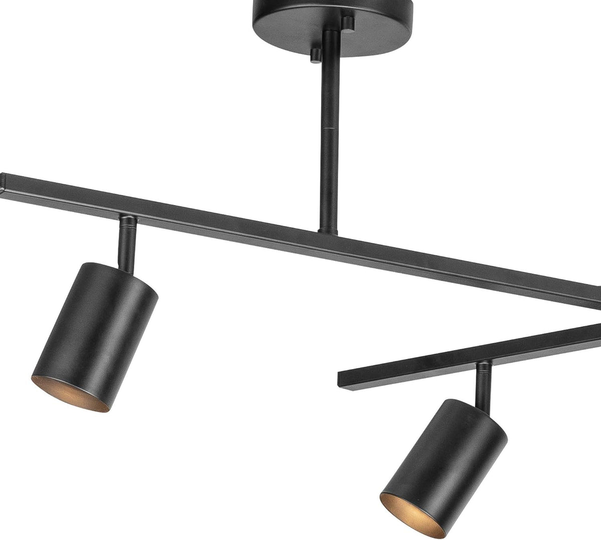 Close-up of matte black cylindrical spotlight heads and central swivel bar showing mounting canopy detail