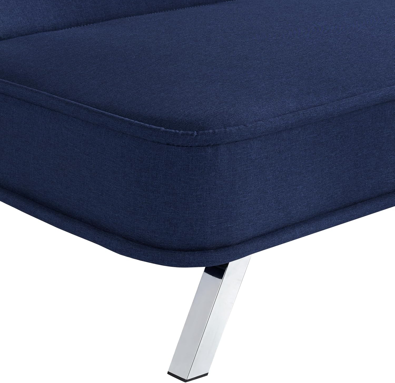 Close-up of navy fabric seat corner and chrome angled leg showing upholstery piping detail