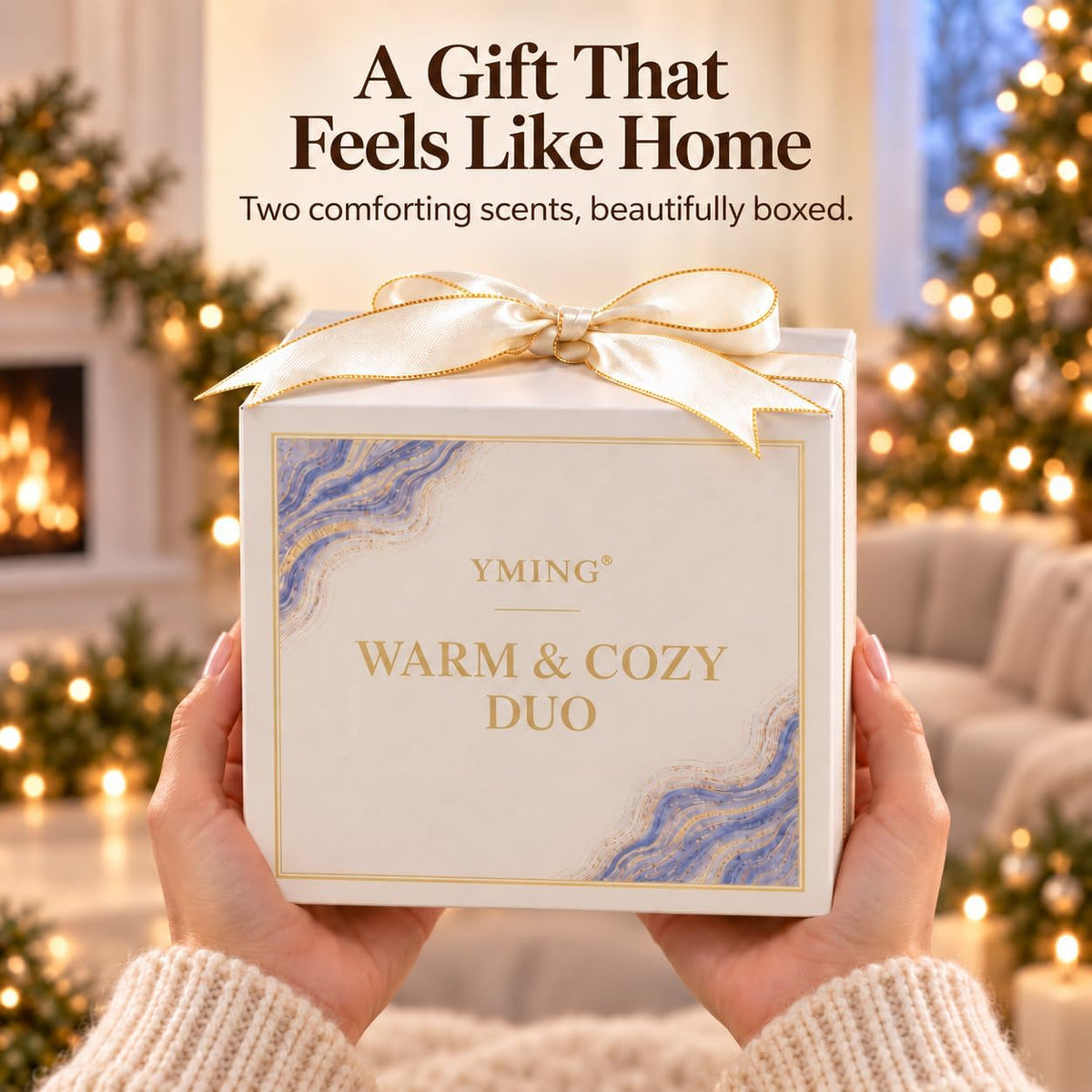 Hands presenting a cream gift box with a gold bow and marbled decorative panel in a holiday-styled living room