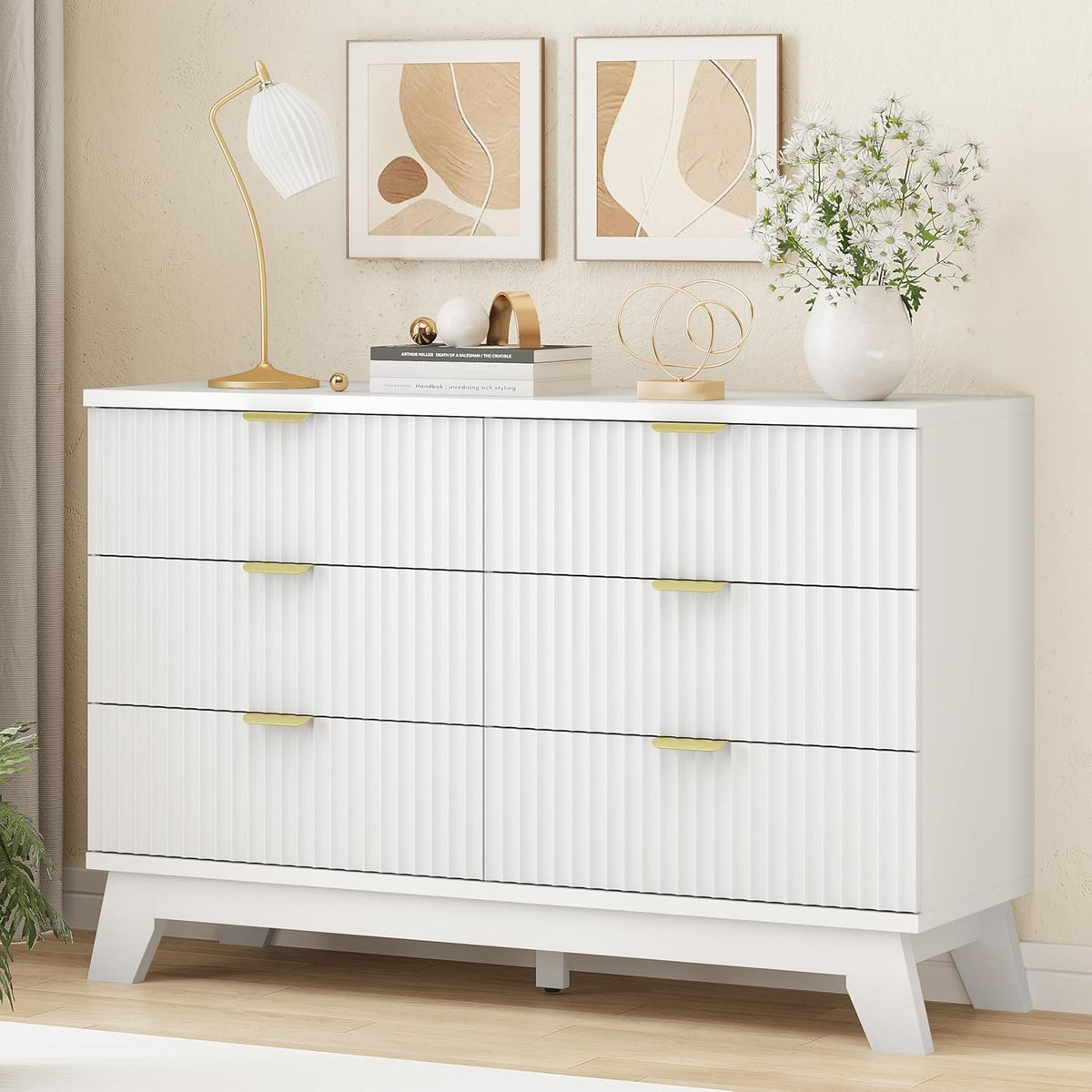 White wave-panel dresser variant with gold handles and decorative lamp and flowers on top
