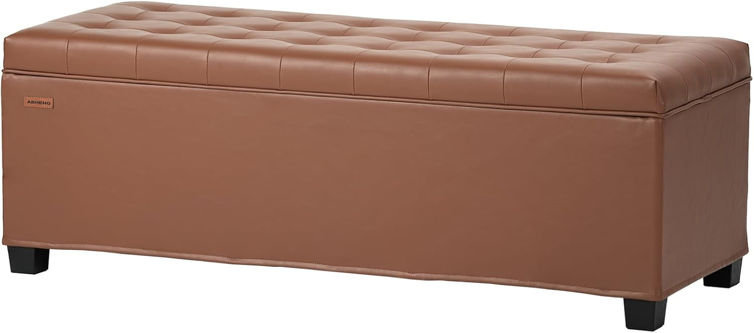 Camel-tan tufted rectangular storage bench with short dark legs, angled view