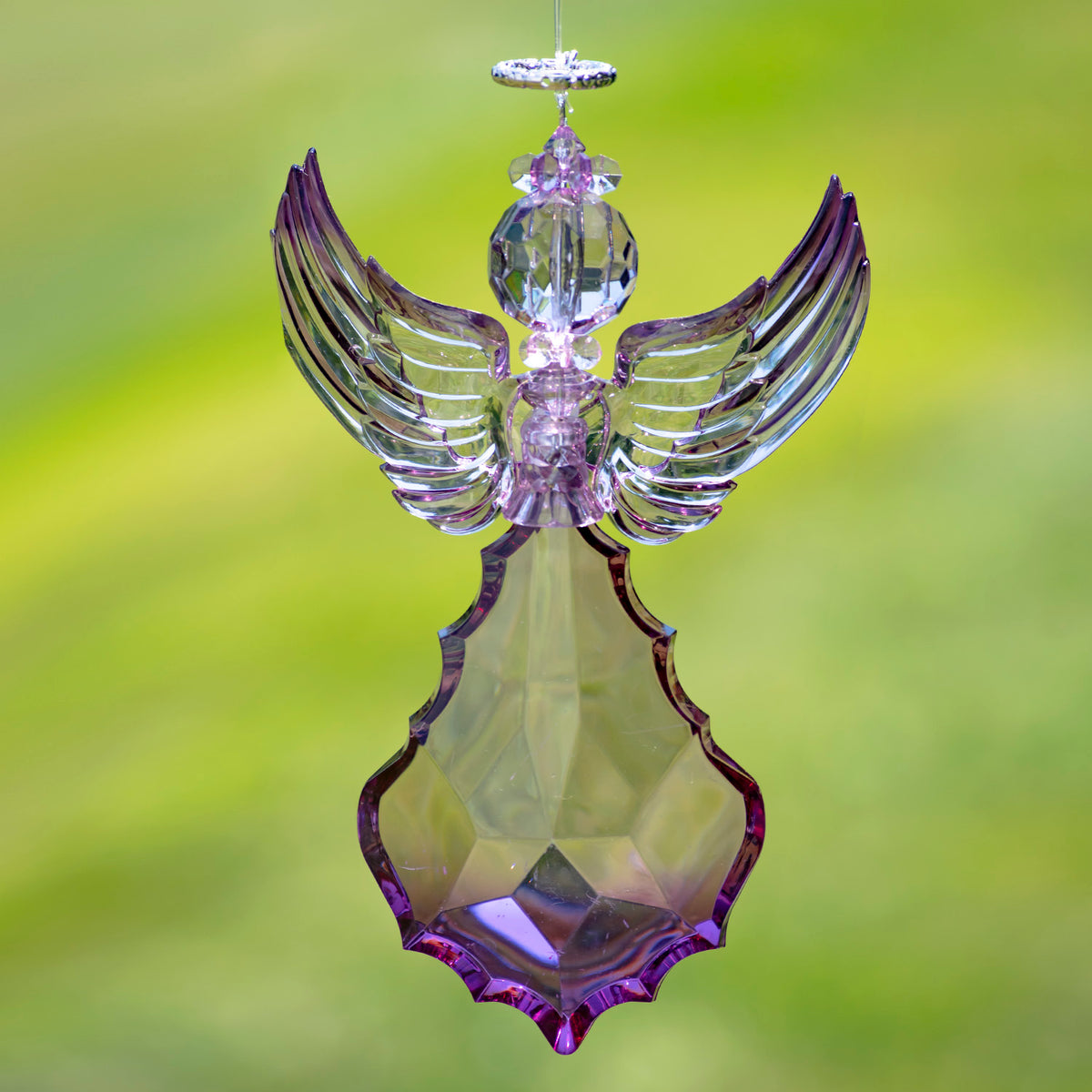 Purple angel ornament with tall wings raised in a wide V shape.