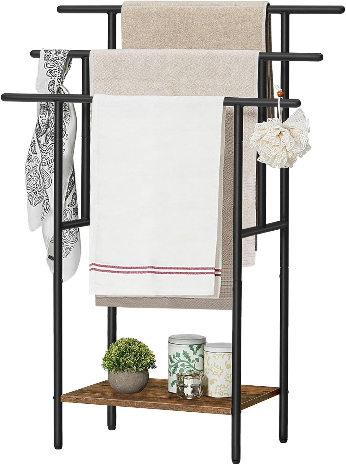 Front close-up of the black towel rack showing three stepped bars with folded towels draped over them.