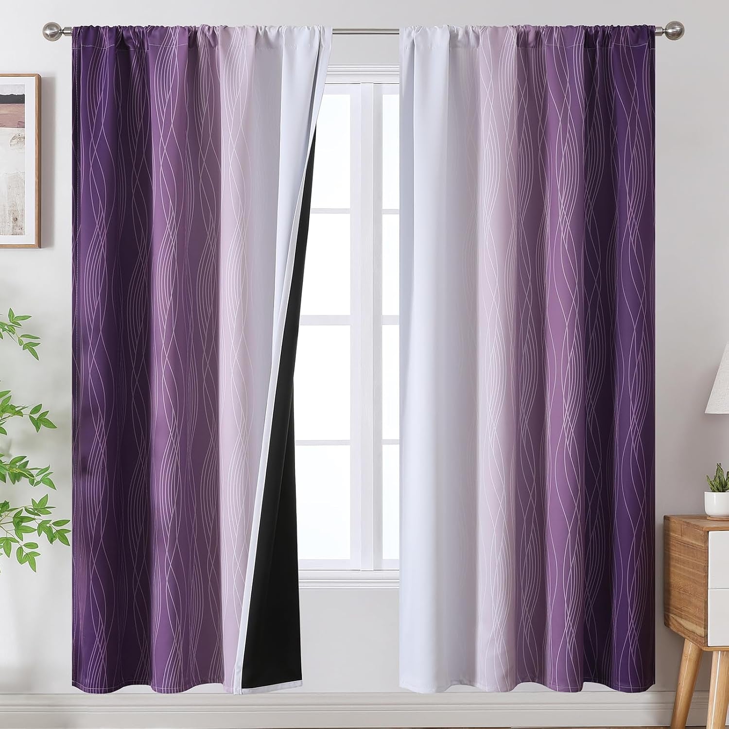Window with two purple-to-white ombre panels patterned with thin wavy lines and a black blackout lining visible