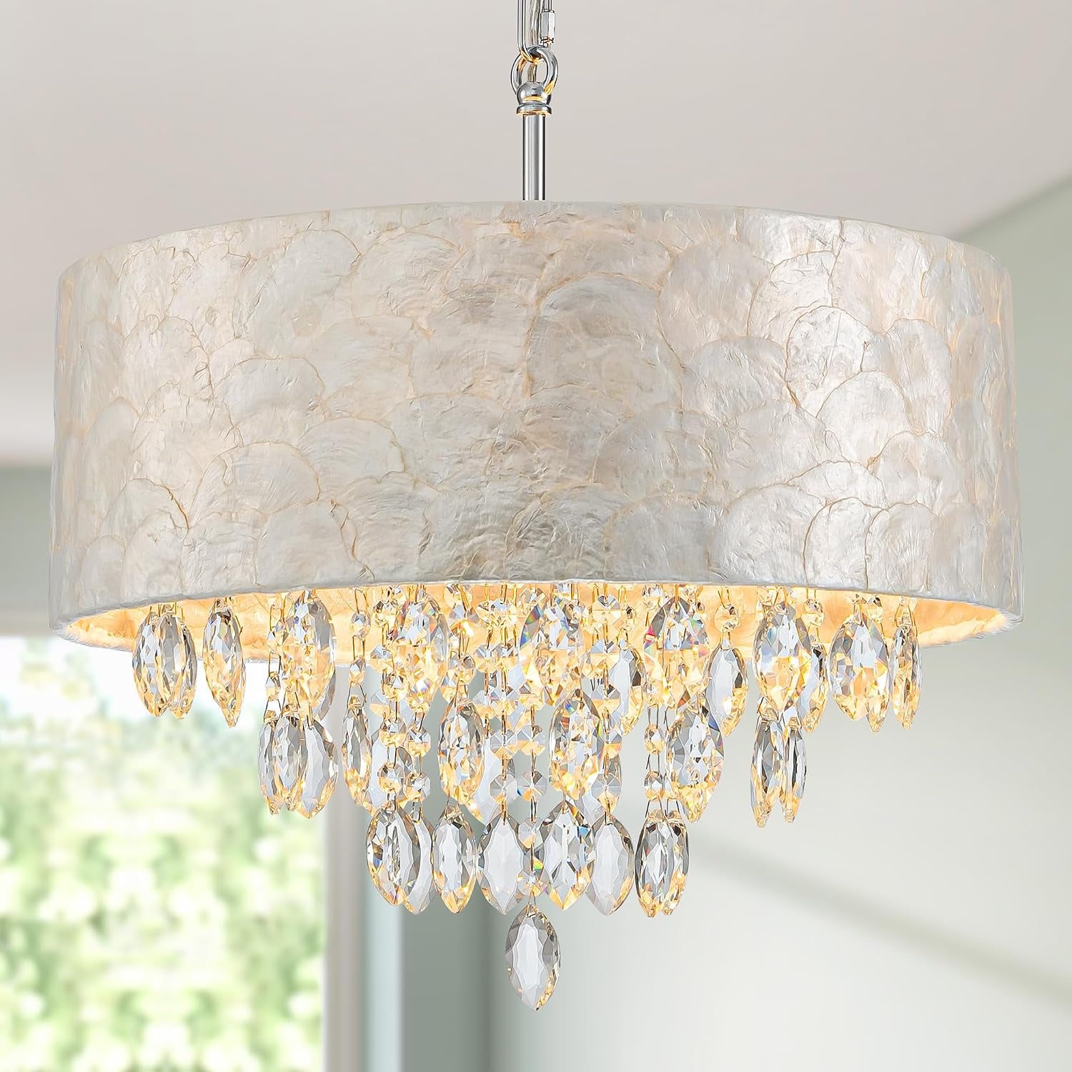 Capiz shell drum chandelier with dangling K9 crystal pendants, close angled view showing chrome canopy and hanging chain.