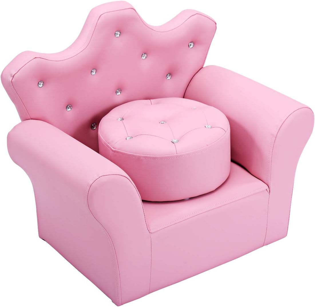 Three-quarter view of a pink toddler armchair with crown-shaped back, crystal button tufting and a round ottoman.