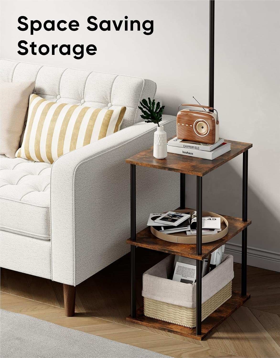 Side view of the three-tier wood table next to a sofa highlighting space-saving storage