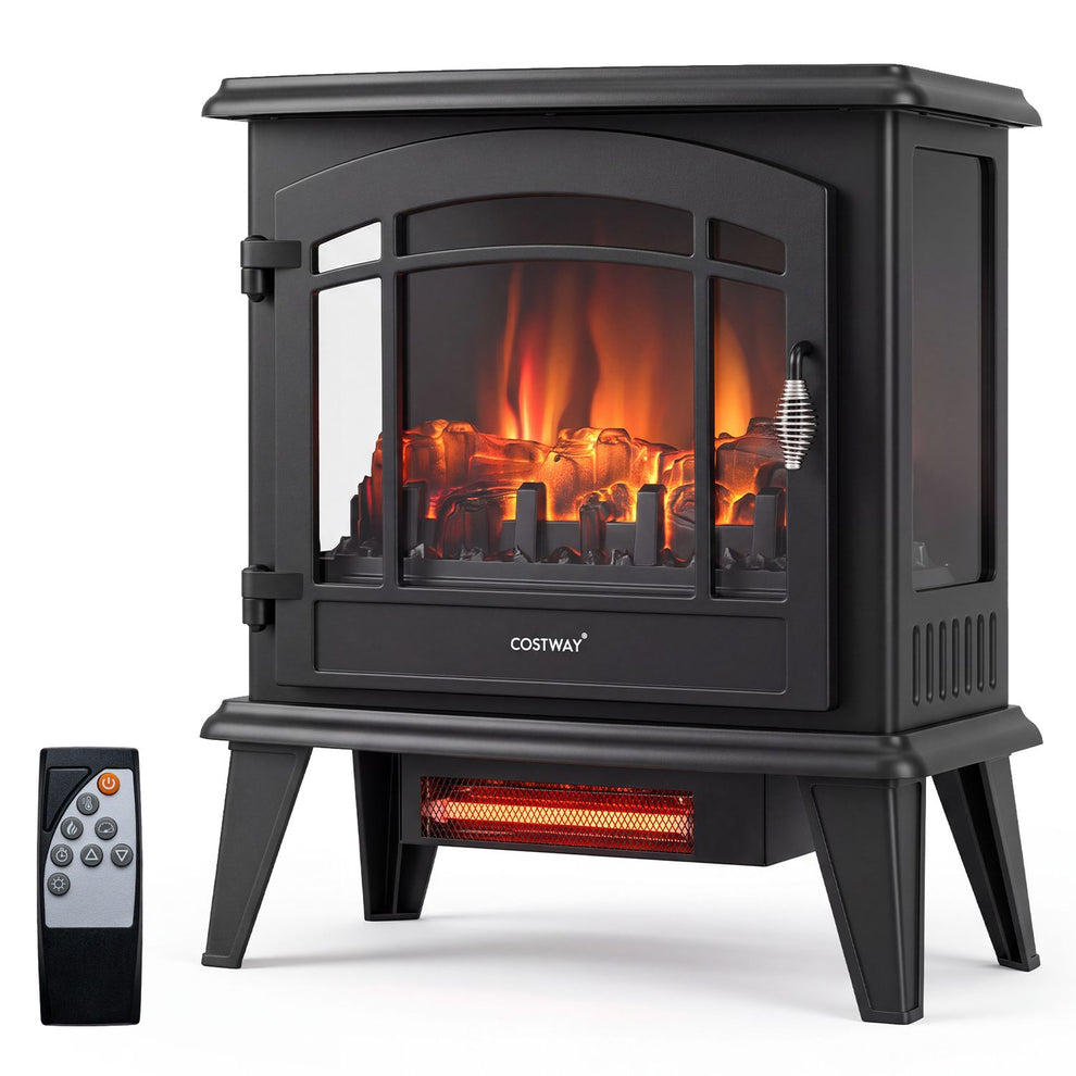 Black freestanding fireplace stove with glowing flames, side windows, four legs, and a remote beside it.