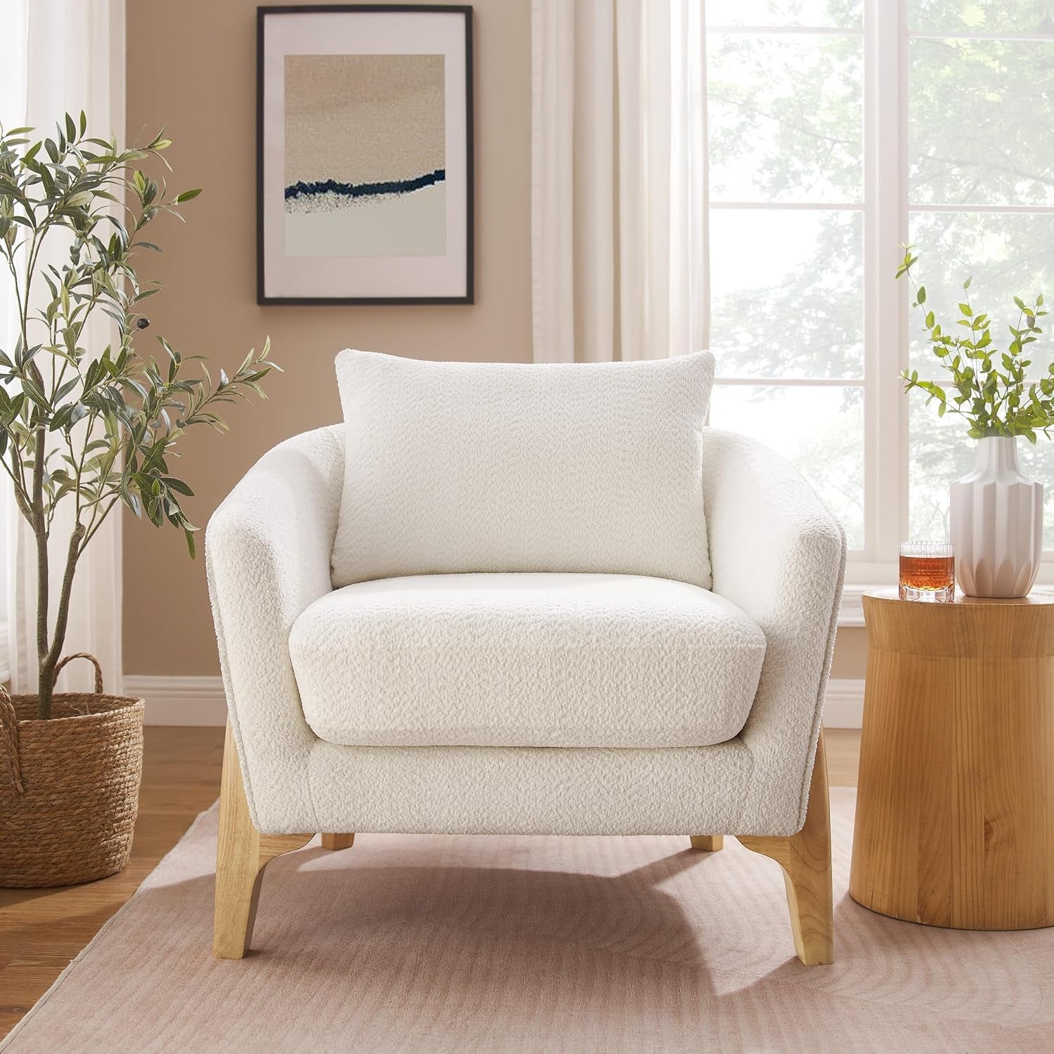 Front-facing view of the white fleece accent chair in a styled living room setting
