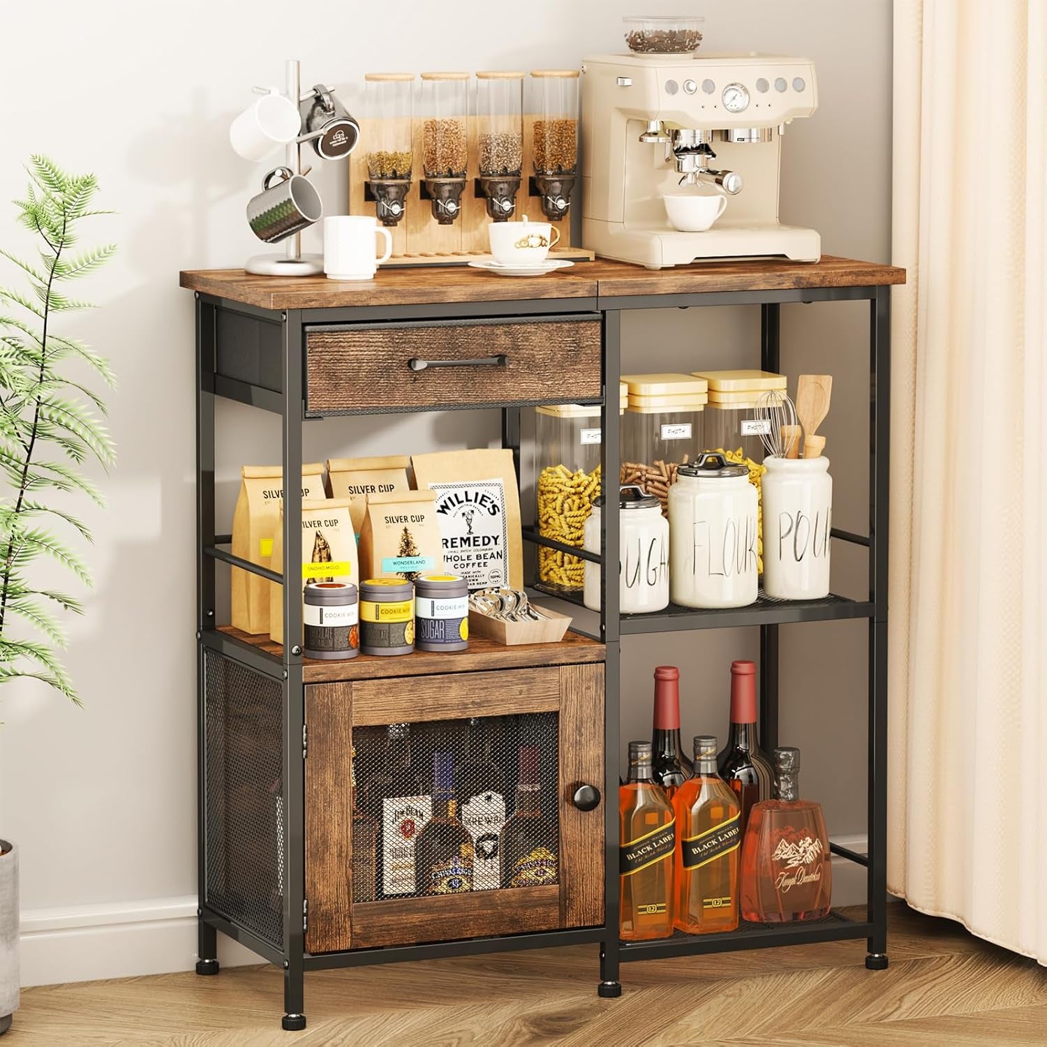 Wood-and-iron buffet placed against a wall with coffee maker, jars, and bottles on its shelves