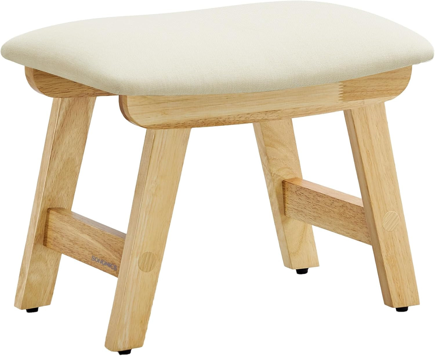 Small light-wood stool with angled legs and a pale upholstered cushion top, photographed at an angle.