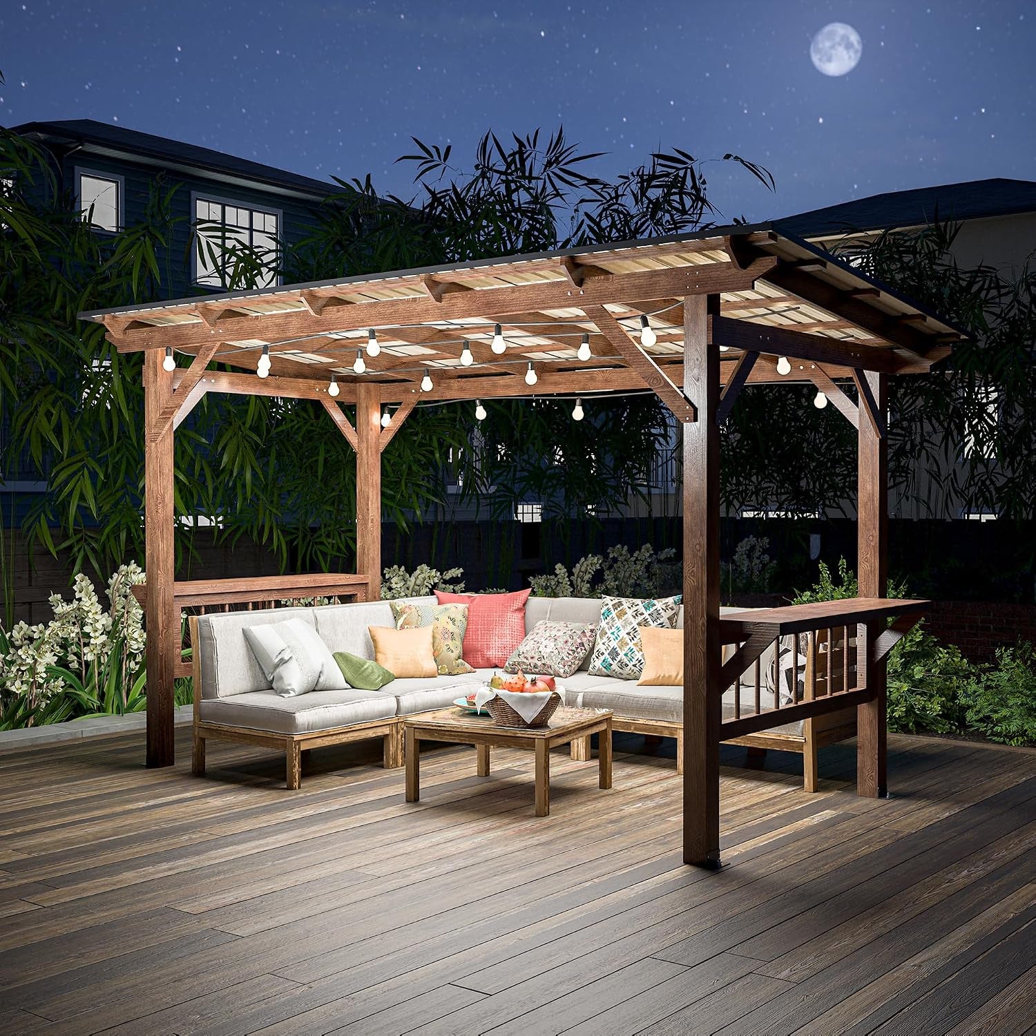 Night view of the wooden grill gazebo lit by hanging string bulbs over patio seating