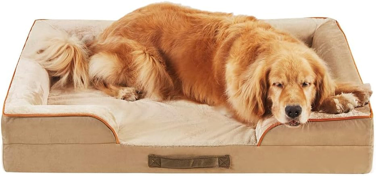 Low front view of a tan bolster dog sofa with a golden retriever lying across it, handle visible on side.