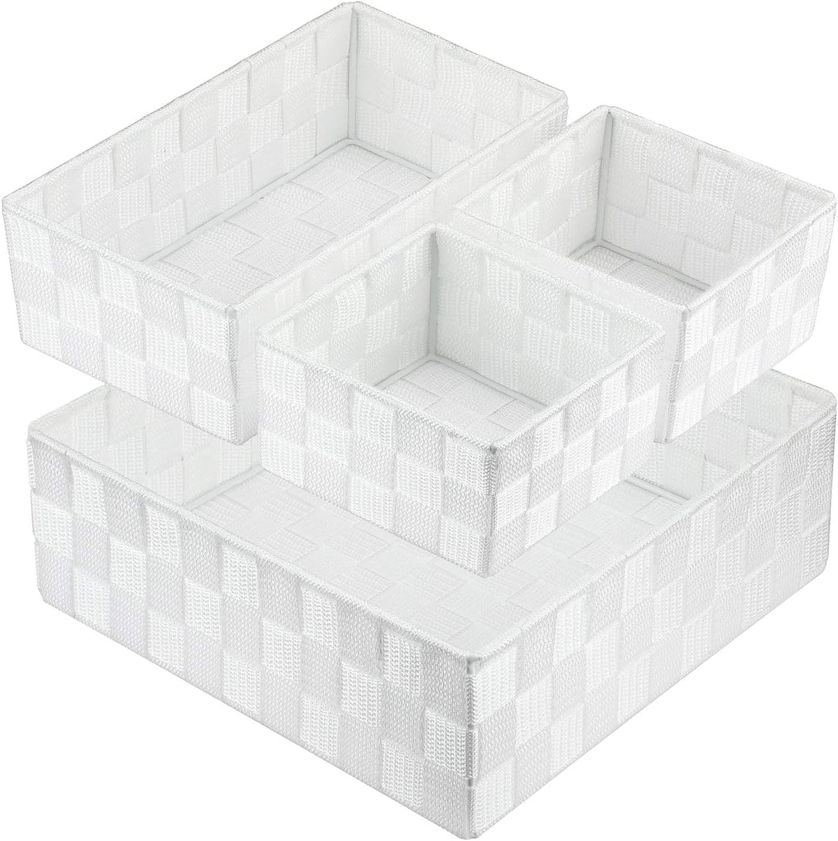 Top-down angled view of four white woven storage baskets nested together.