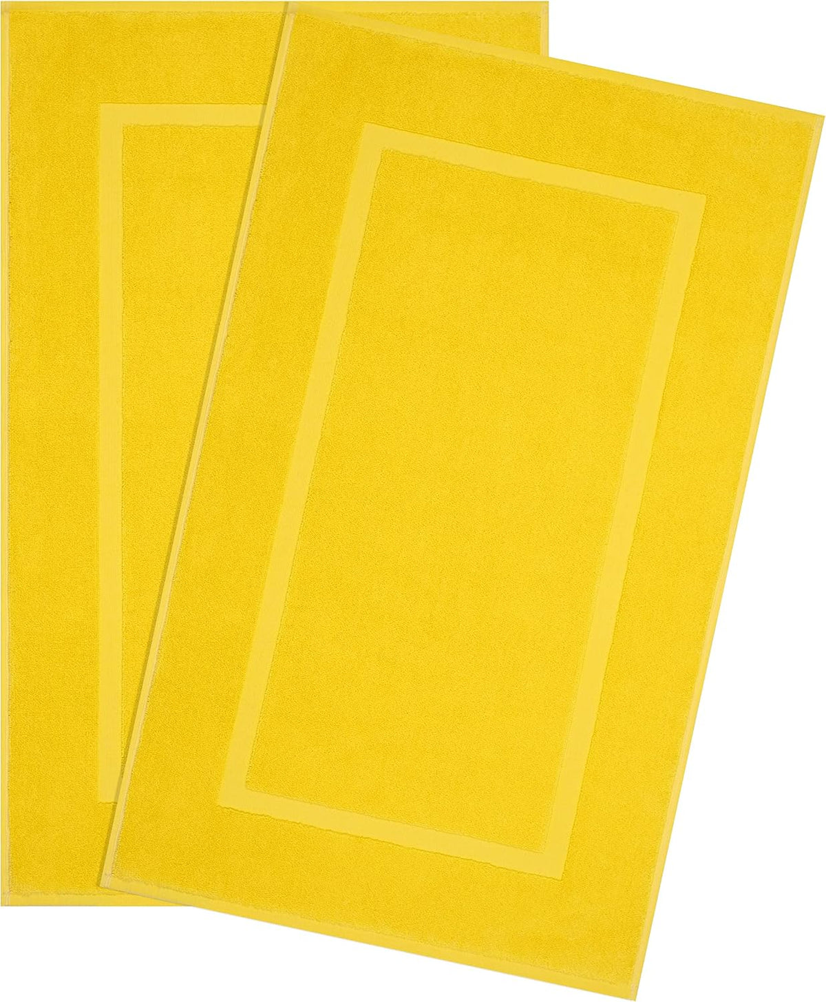 Two bright yellow rectangular bath mats overlapping, each with an inset border detail