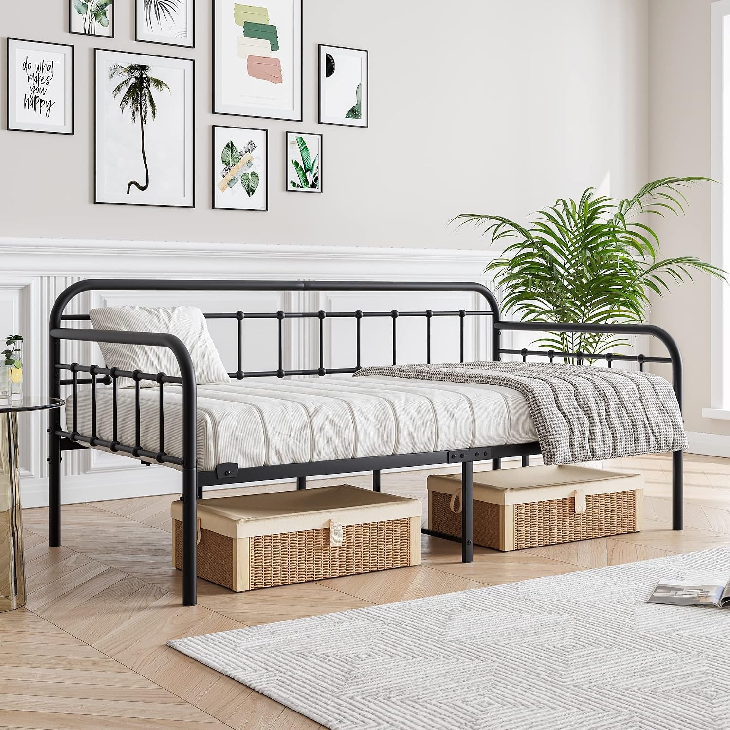 Black twin daybed side view with under-bed storage baskets visible and Victorian-inspired rail detailing