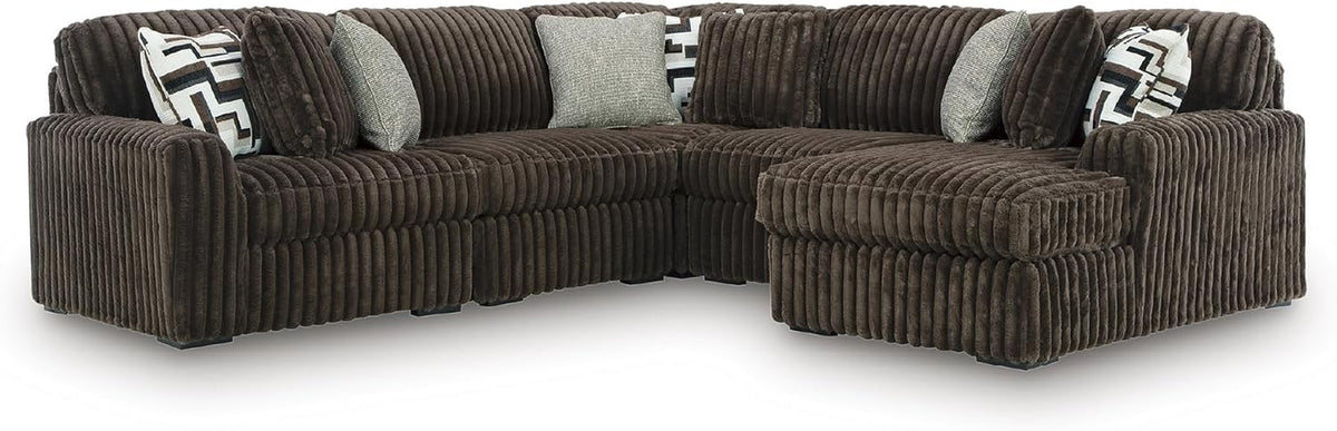 Chocolate-brown oversized corduroy sectional with right chaise and mixed accent pillows
