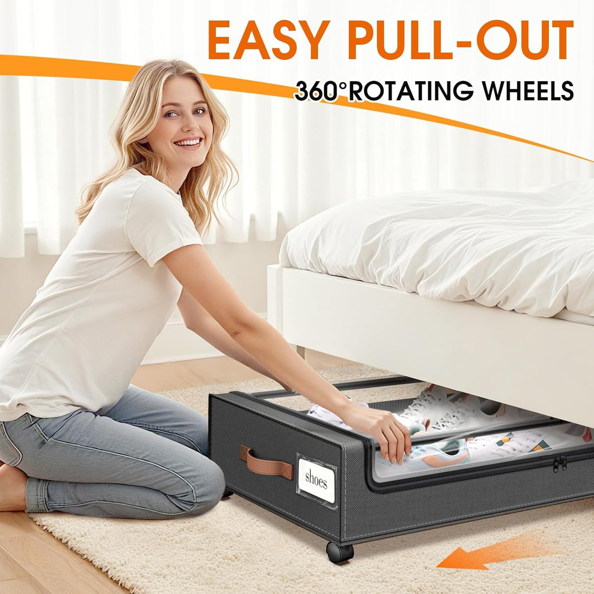 Person pulling a dark grey underbed storage box with rolling wheels from beneath a bed to show easy pull-out access