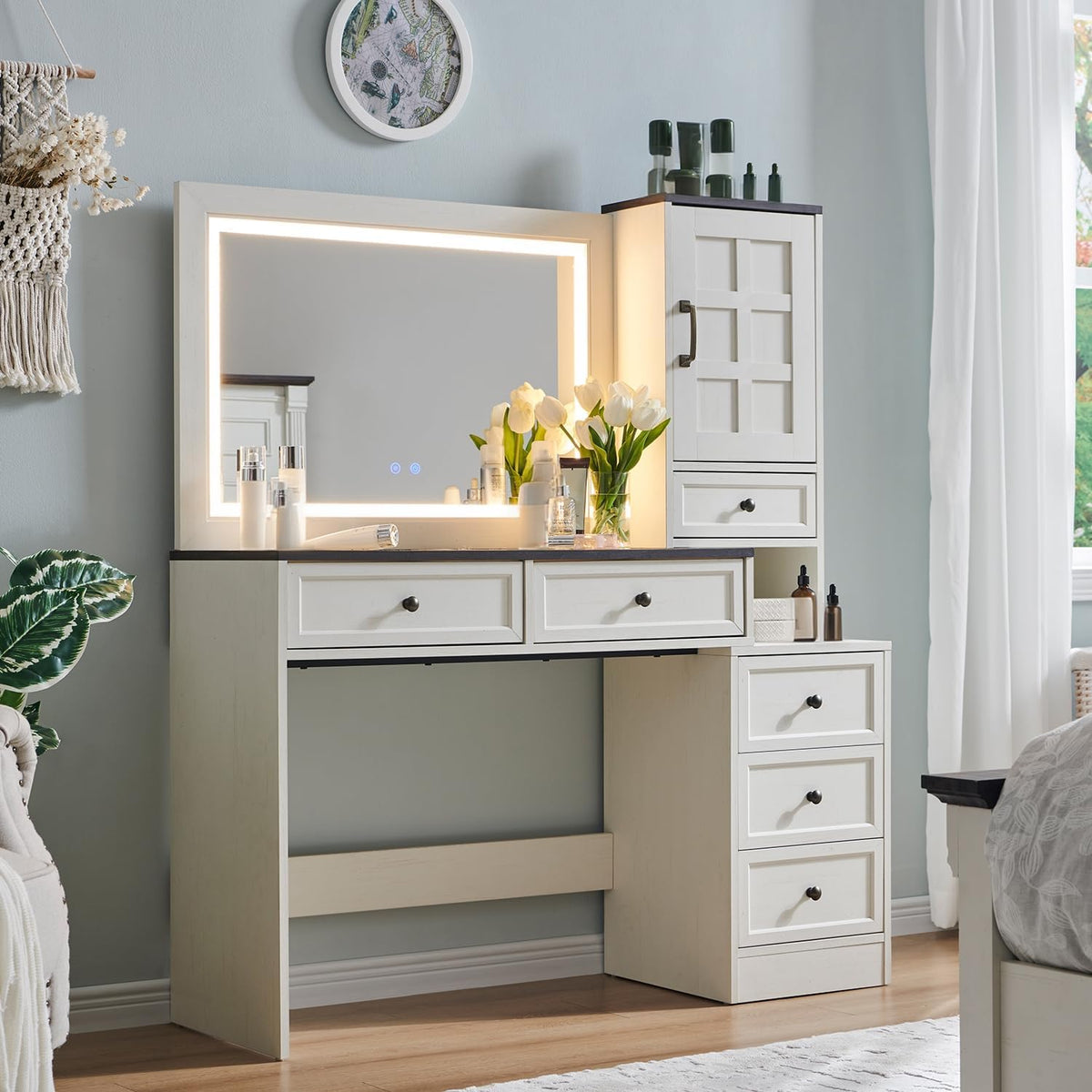 Slim white vanity desk with LED-framed mirror, two drawers above knee space and a vertical side cabinet with three drawers.
