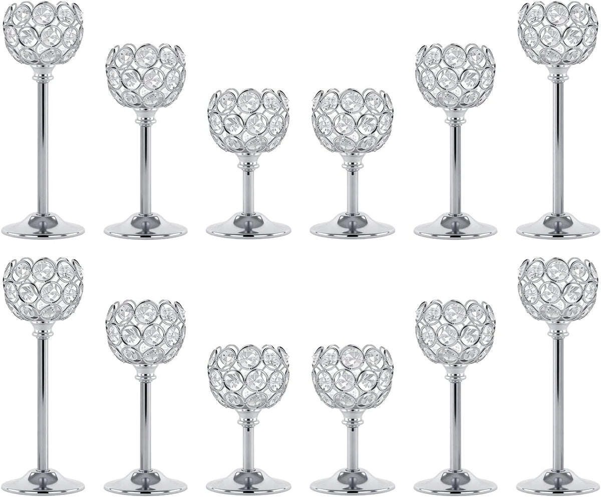 Staggered two-row studio shot of multiple silver crystal tealight holders in varying heights.