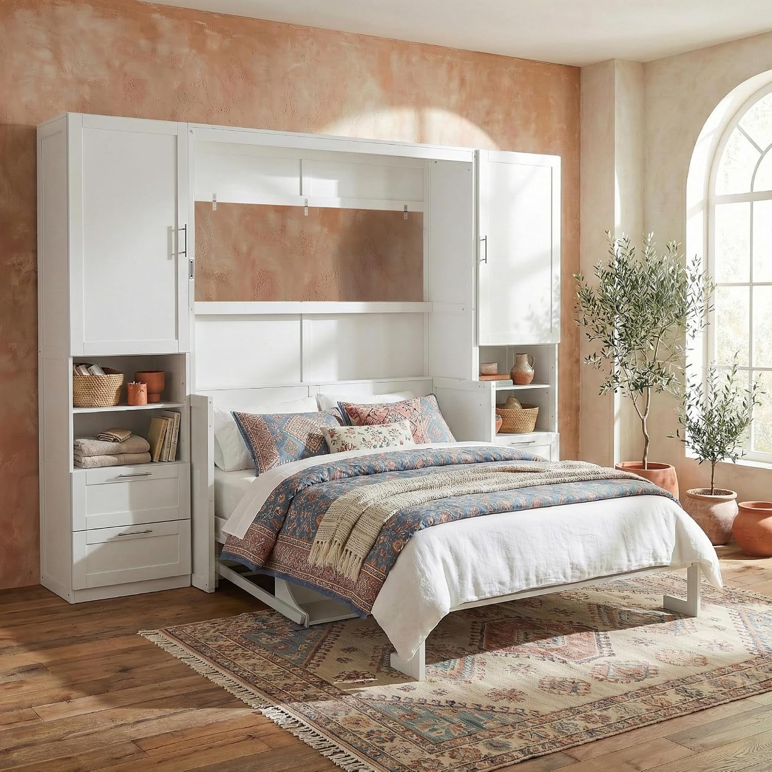 White Murphy wall bed open to bed position with patterned bedding and twin storage towers in a cozy styled room
