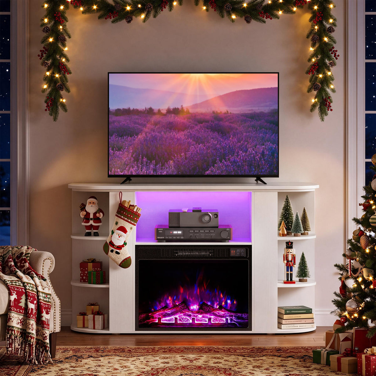 White fireplace TV stand with purple accent lighting and a glowing fire, decorated for Christmas.