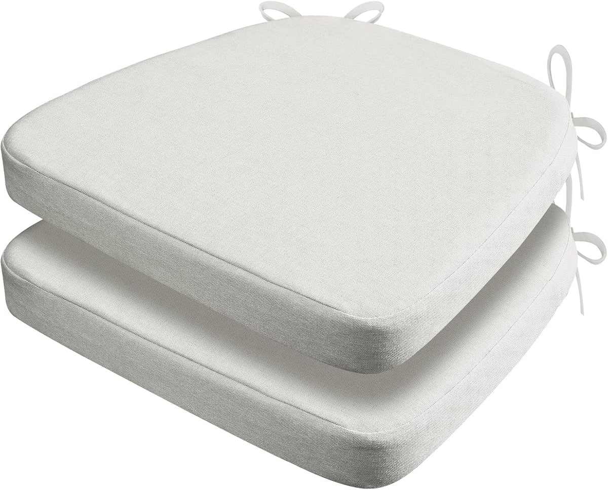 Two white D-shaped chair cushions stacked, shown at a slight top-front angle with rounded front corners and rear tie loops