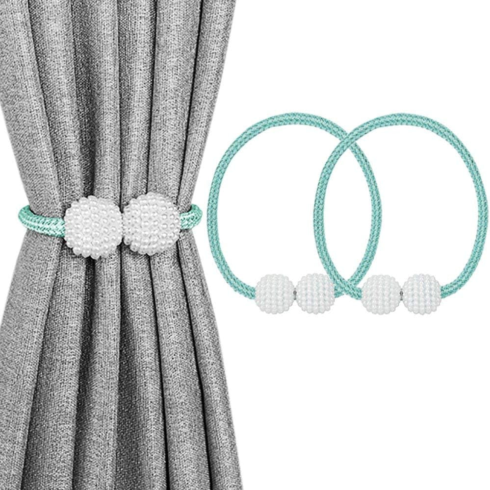 Aqua/teal braided magnetic tiebacks with white beaded spheres shown wrapped around a gray curtain and as two spare sets