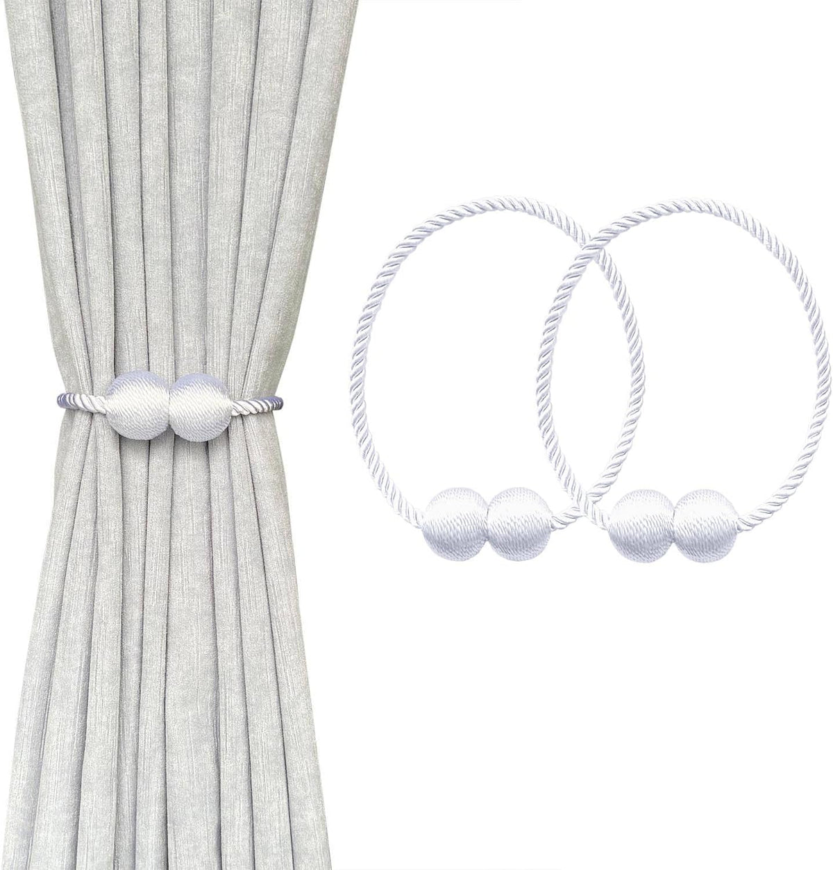 Close view of a light gray curtain held by a white rope tieback with two round pearl balls and extra rings shown