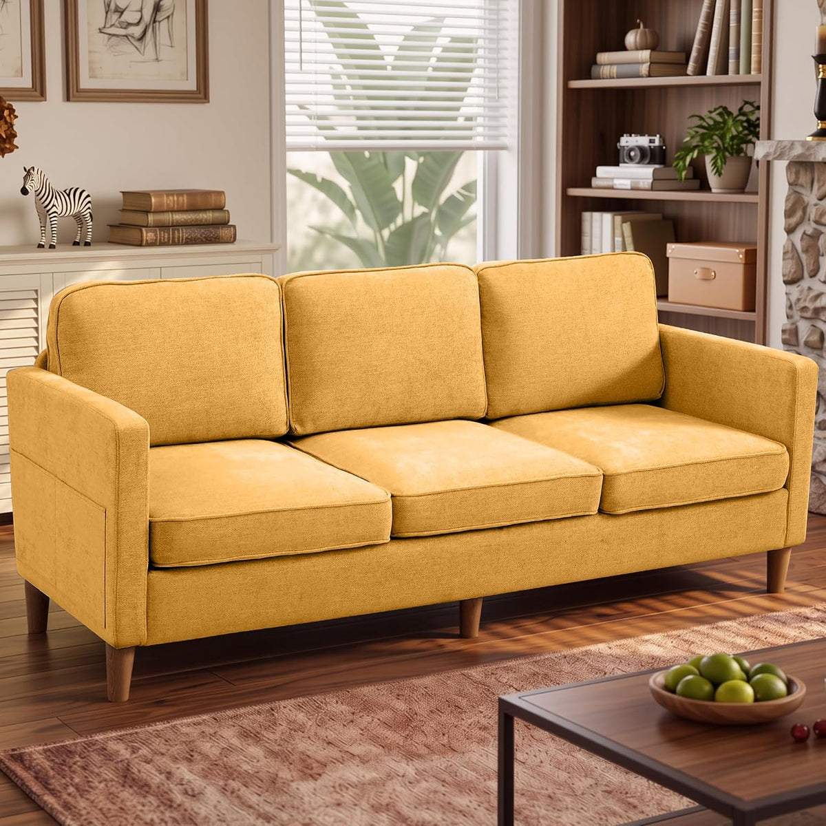 Mustard-yellow three-seat sofa set in a warm living room with a coffee table in front