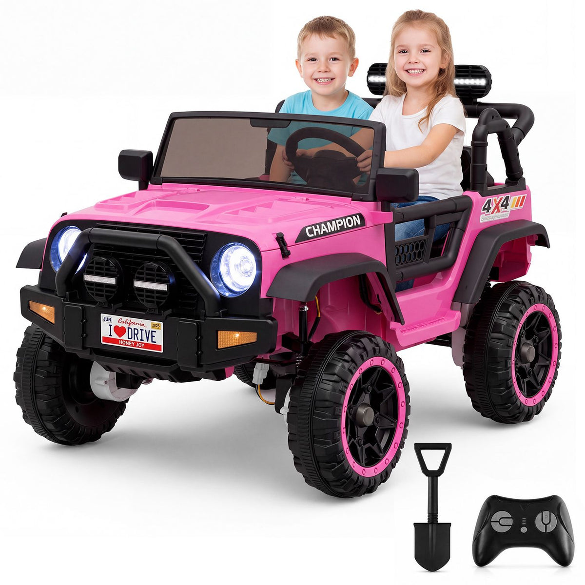 Two children sit in the pink truck beside a handheld remote and a small shovel.