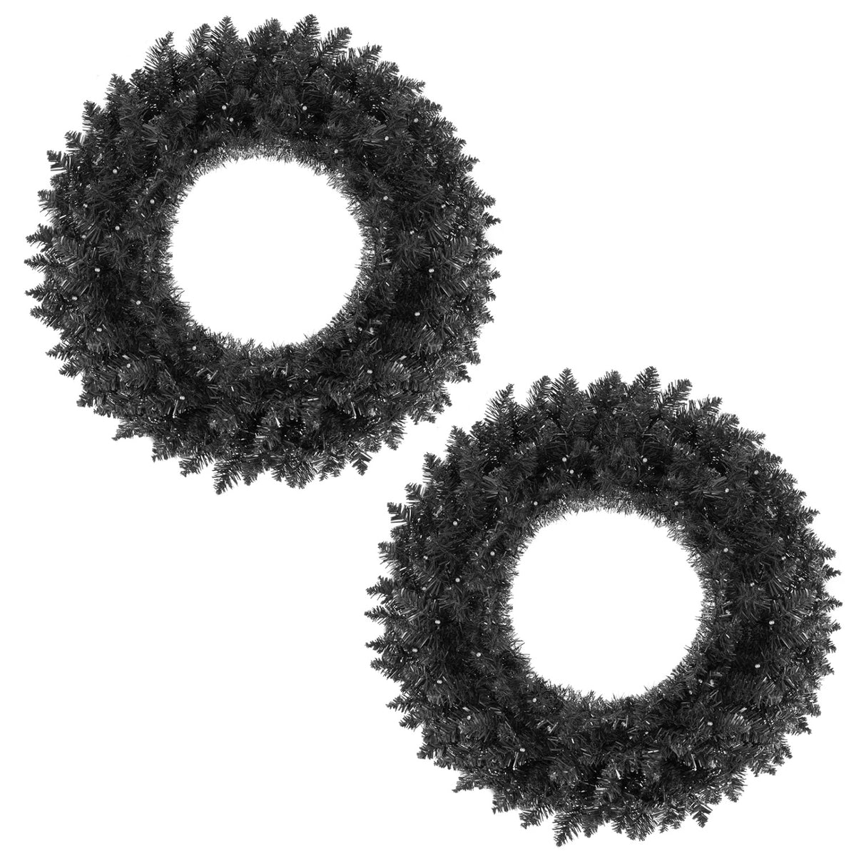 Two unlit leafy wreaths arranged diagonally against a white background.