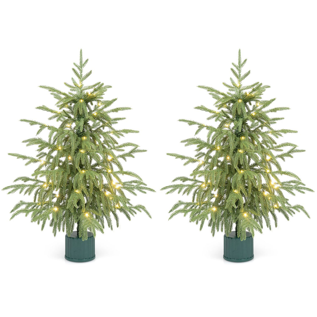 Two matching tabletop trees glowing with warm lights against a white background.