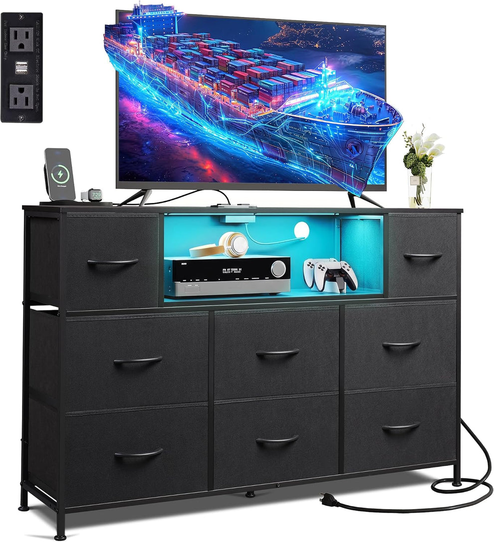 Black 8-drawer dresser with illuminated open shelf and TV on top, front angled view