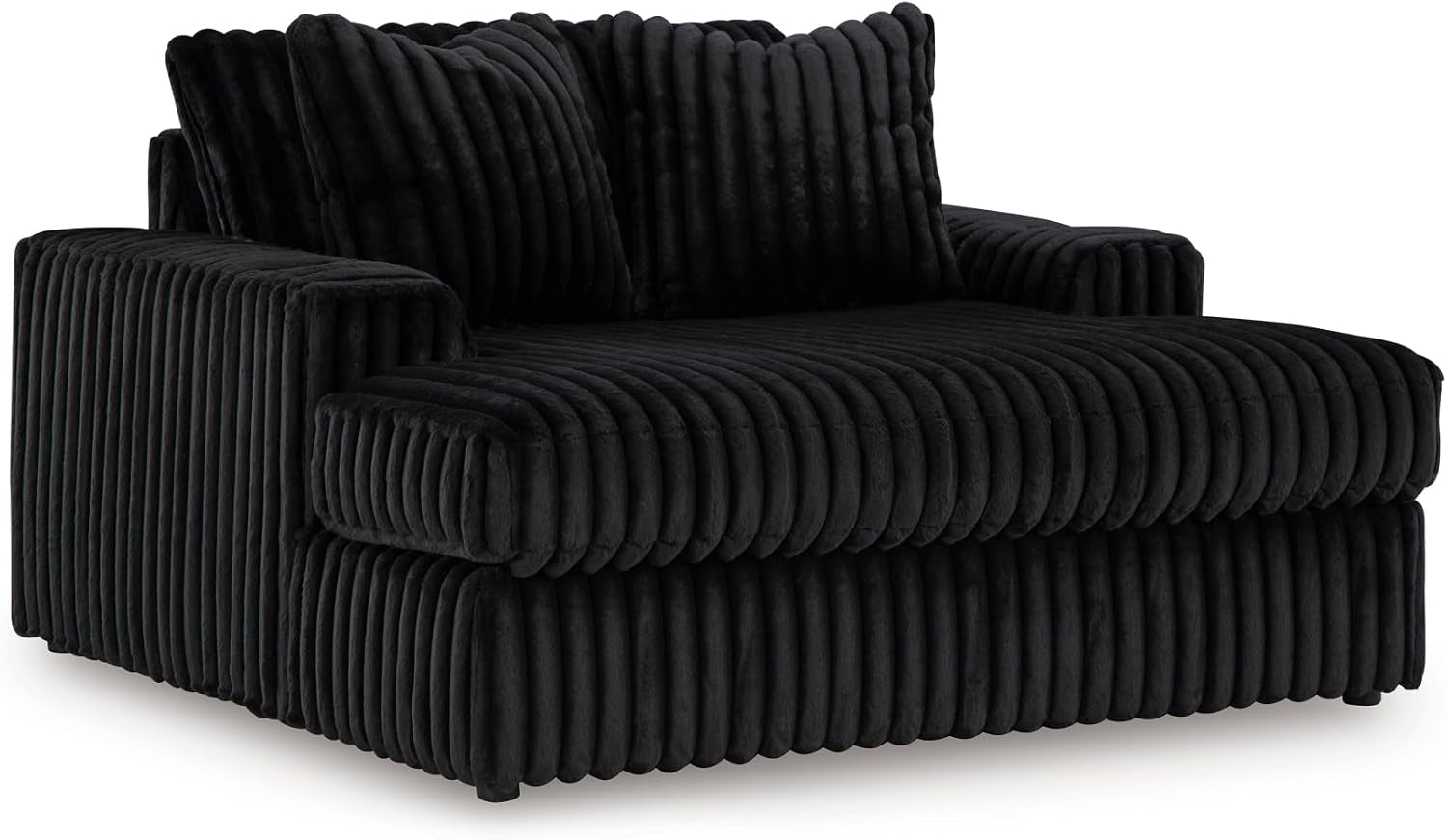 Single oversized lounge chair in black jumbo corduroy with deep ribbed cushion texture and matching back pillows.