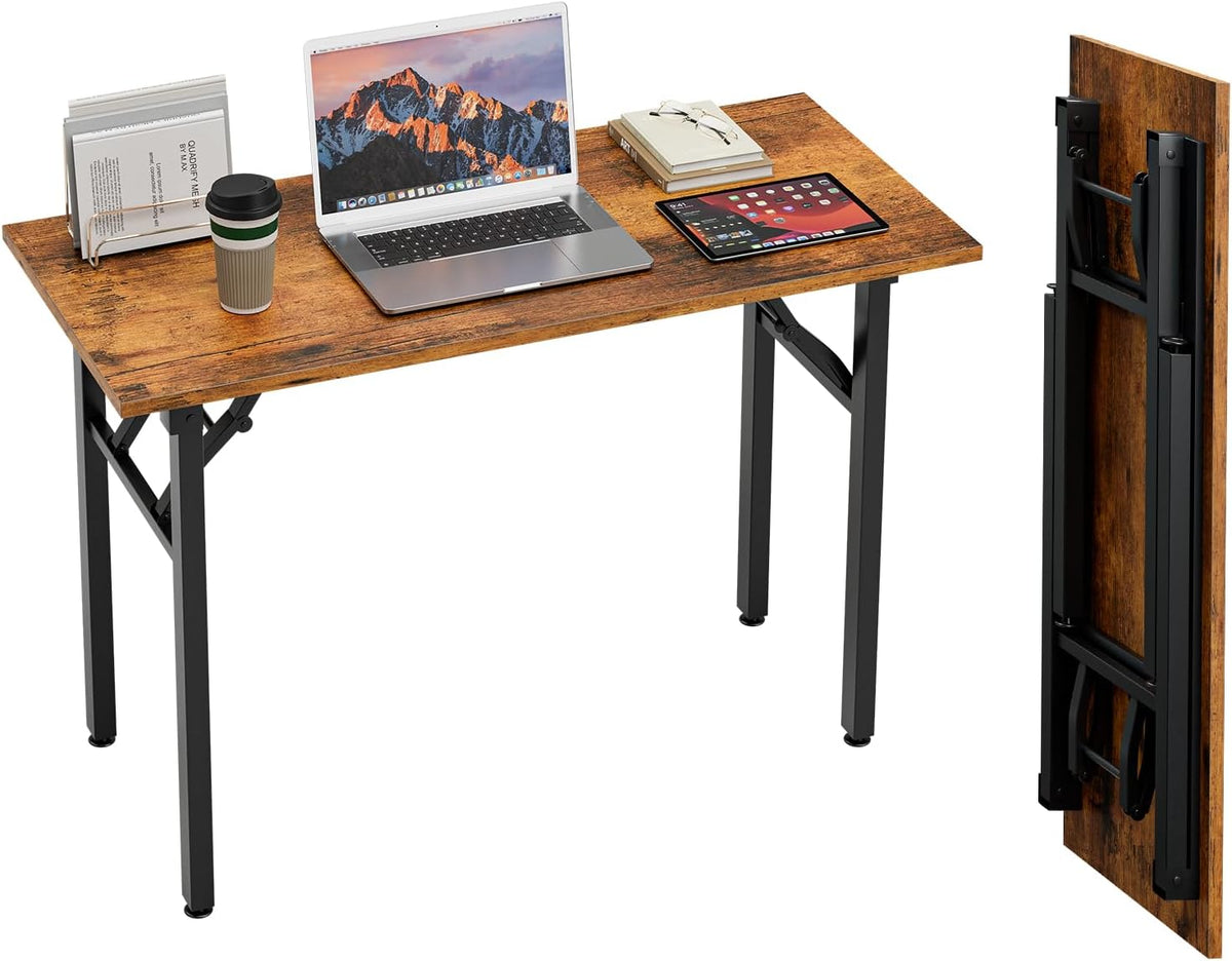 Wood-grain desk arranged with dual monitors, keyboard and phone charging at the right, plus the folded desk stored upright