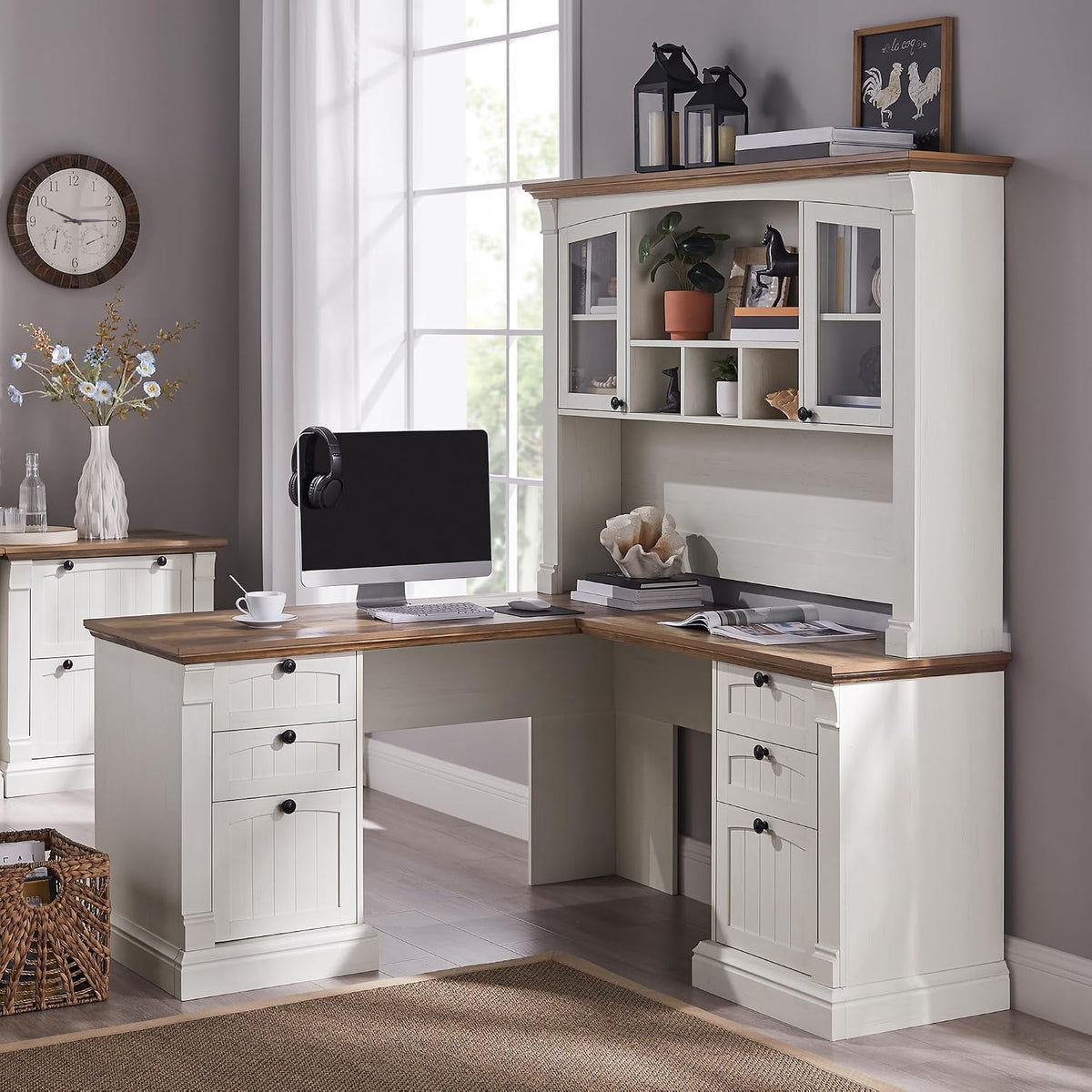 Antique white L-shaped farmhouse desk with wood-tone top and 42 in hutch shown in a staged home office, angled front view