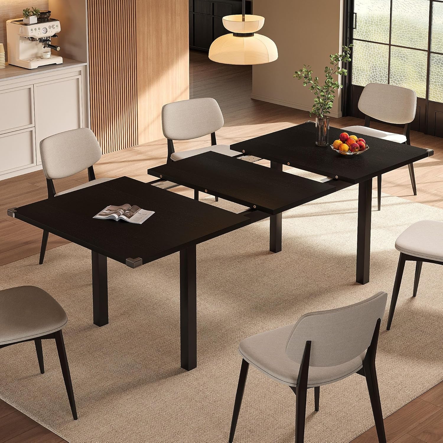 Same extendable table shown in a black wood finish with the center leaf pulled out.