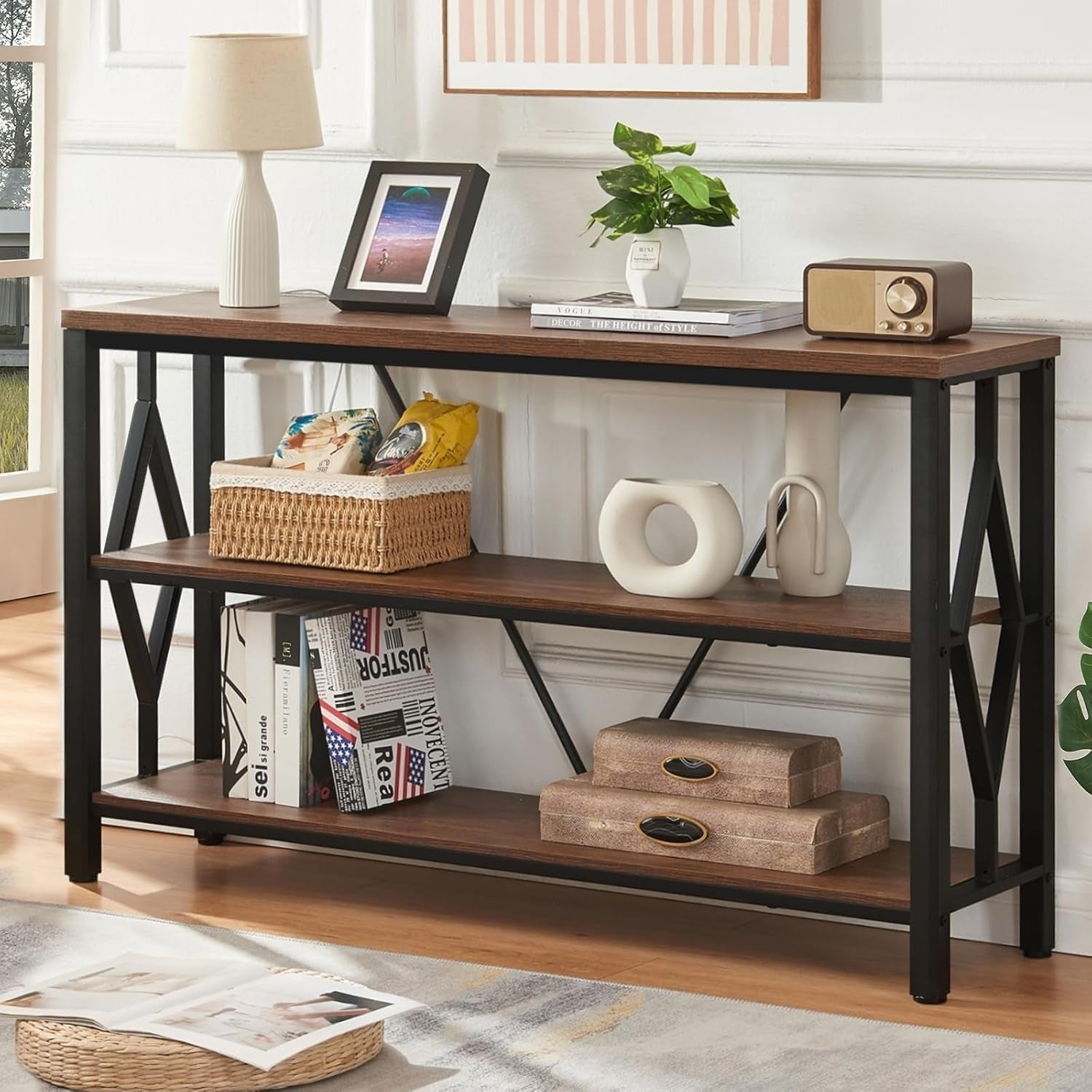 47-inch rustic brown console table styled with lamp, plant and decor, front view against wall