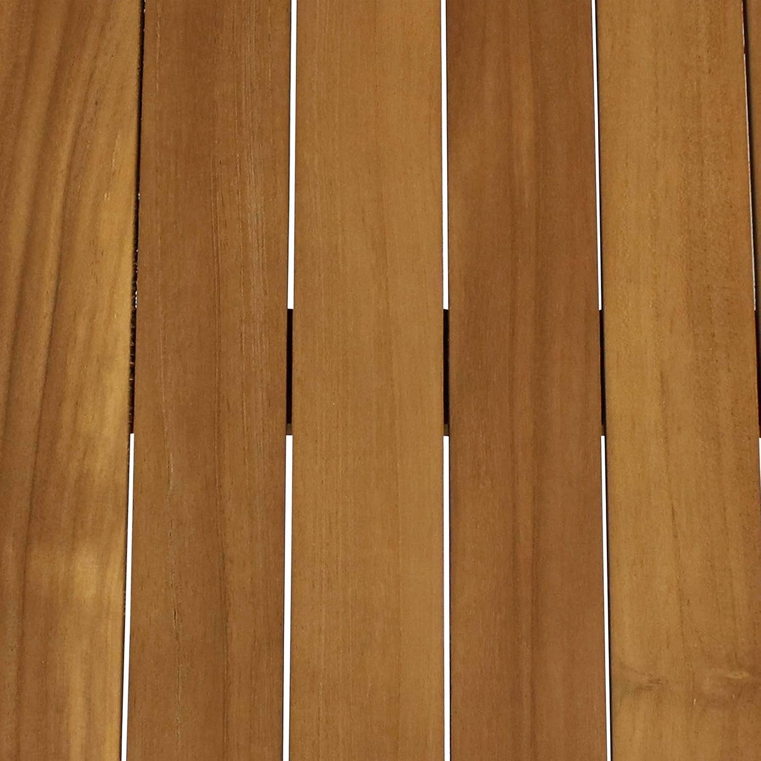 Top-down close-up of four light-brown teak slats with narrow gaps between the boards.