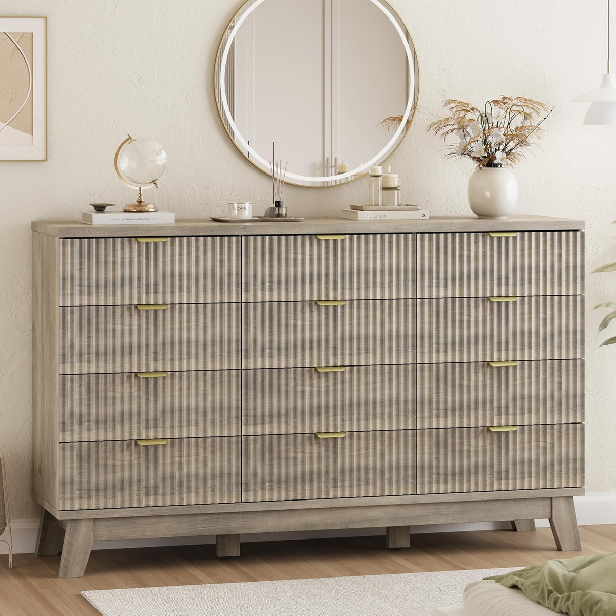Main room shot of a gray-wash wave-panel dresser with gold metal drawer pulls