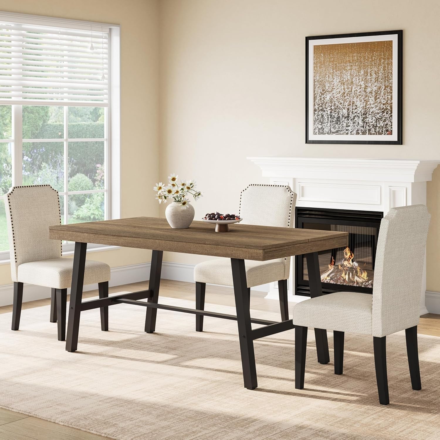 Same dining table shown with a darker brown wood top, four upholstered beige chairs and a fireplace