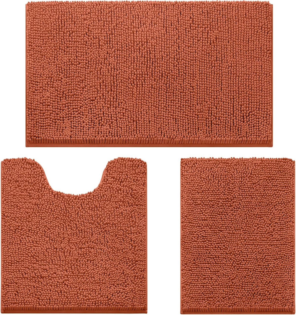 Three-piece rust chenille bathroom rug set flat-lay: large rectangular mat, contoured toilet mat, and rectangular rug.