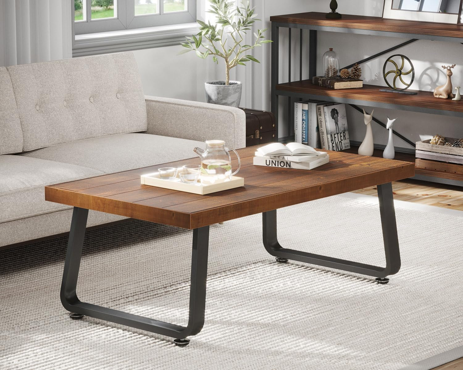 Rectangular rustic fir coffee table with black U-shaped legs centered in front of a light sofa