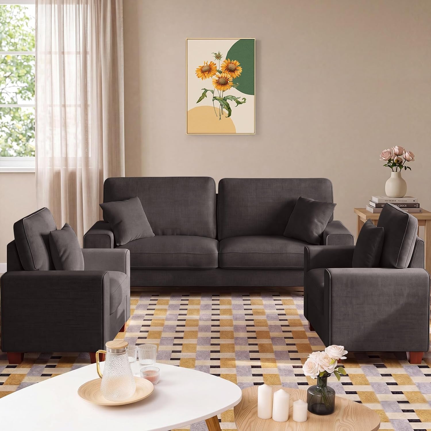 Dark gray sofa set front view with two matching armchairs and a patterned rug