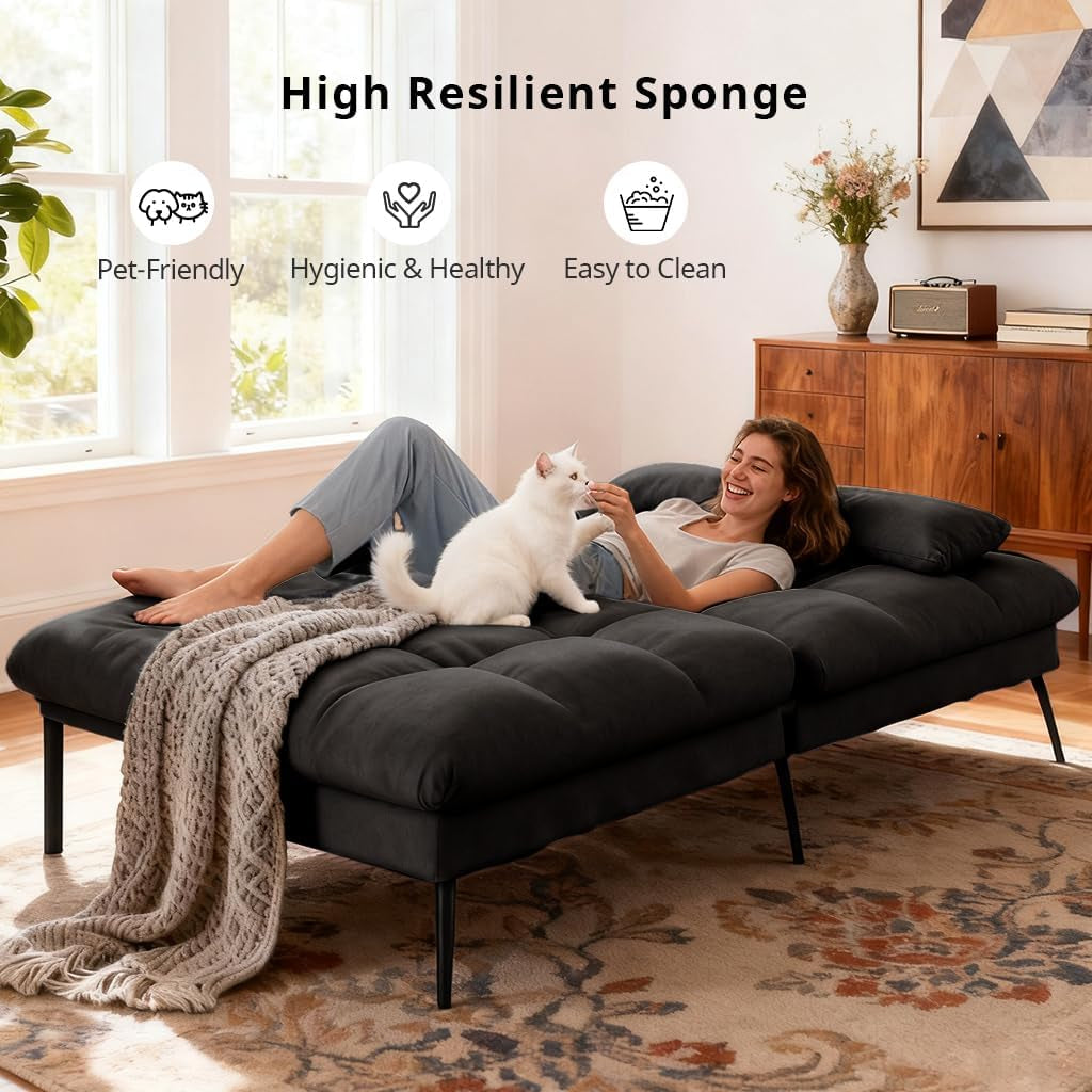 Woman reclining on the futon showing ergonomic curved back and seating support